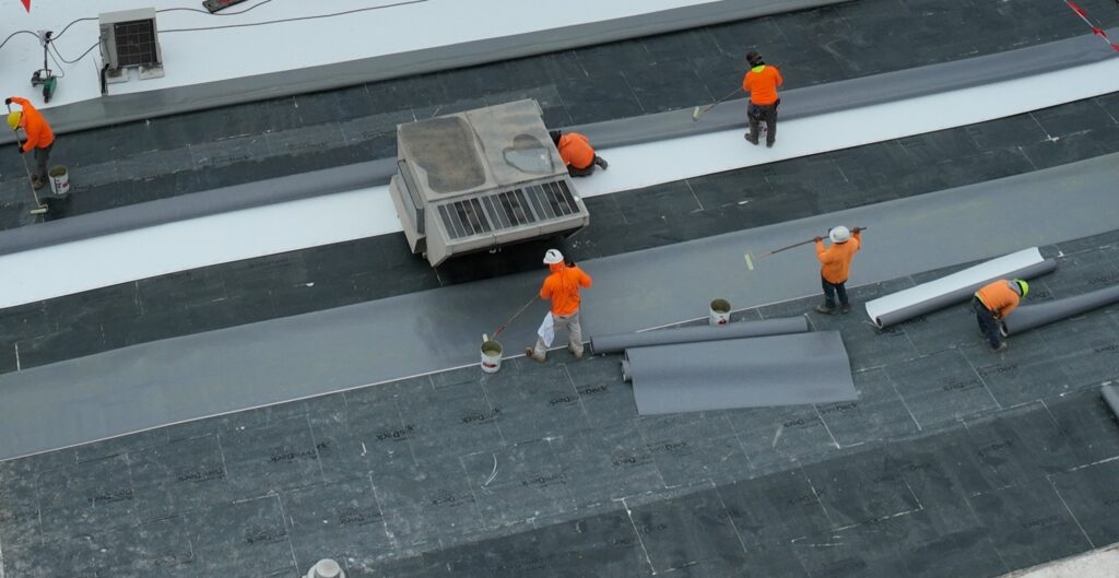 roofers working on black rood